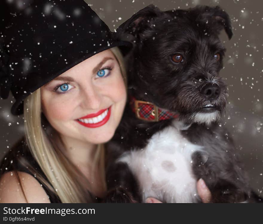 Portrait of Smiling Woman With Dog in Winter