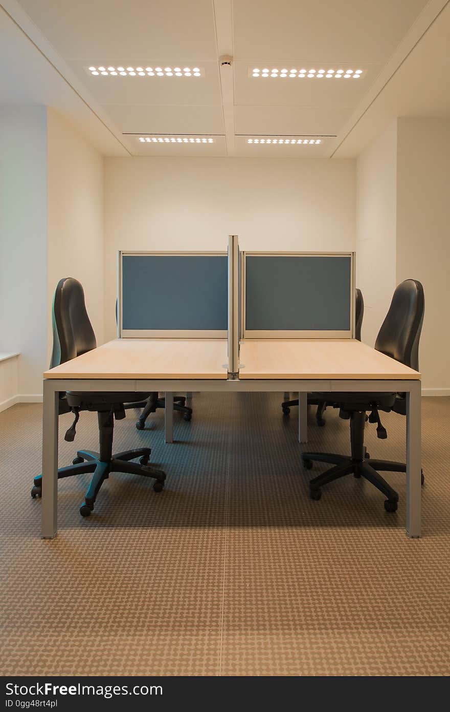 Office with empty cubicles and chairs.