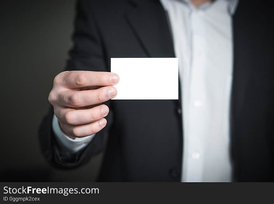 Close-up of a Person Hand With Card