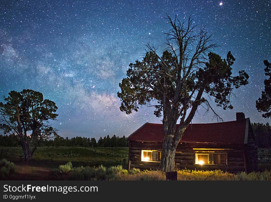 A cabin on the countryside under the stars. A cabin on the countryside under the stars.