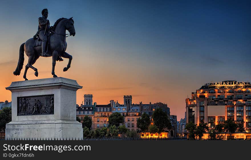 Man Riding Horse Sculpture