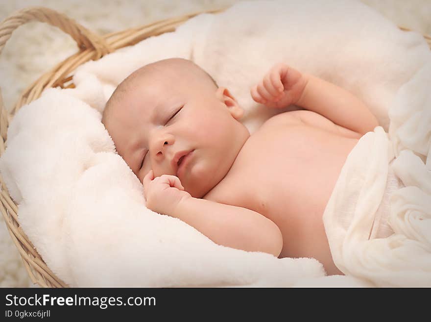 Baby Sleeping on White Cotton