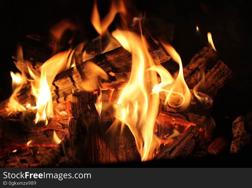 A fireplace with burning cinders and coals.