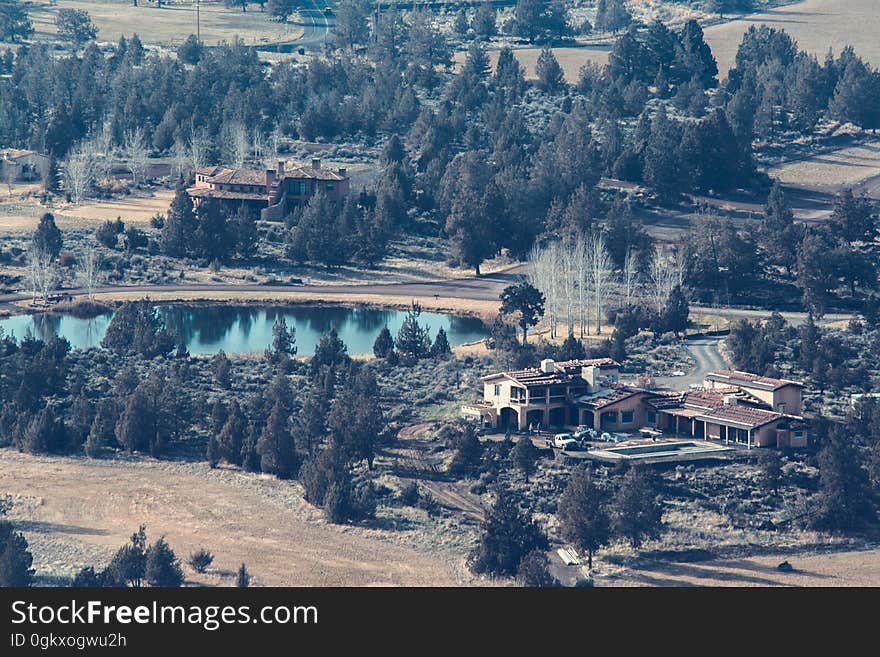 An aerial view of a village by a lake. An aerial view of a village by a lake.