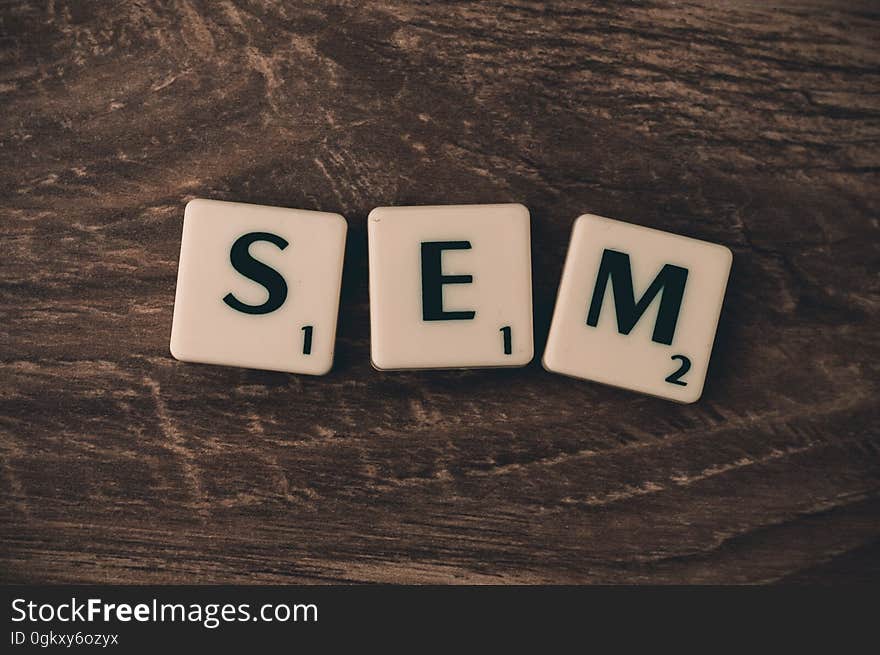 Letters blocks spelling search engine marketing acronym SEM on wooden background. Letters blocks spelling search engine marketing acronym SEM on wooden background.