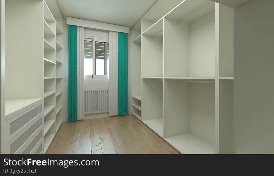 A view inside a walk-in-closet in a modern apartment. A view inside a walk-in-closet in a modern apartment.