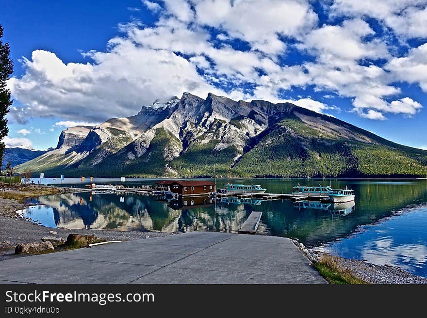 A mountain landscape with a marina in front. A mountain landscape with a marina in front.