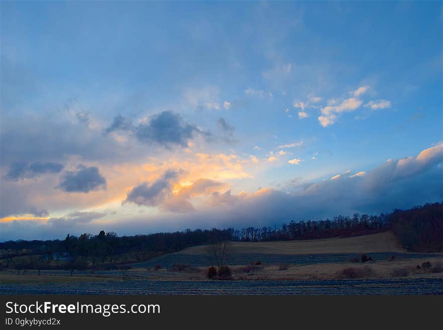 A cloudy sky at sunset.