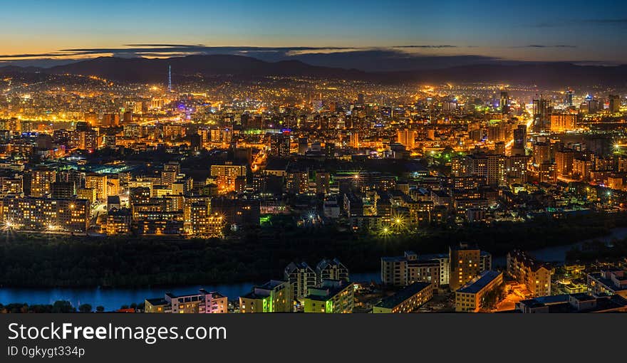 A panoramic view of a city at dusk. A panoramic view of a city at dusk.