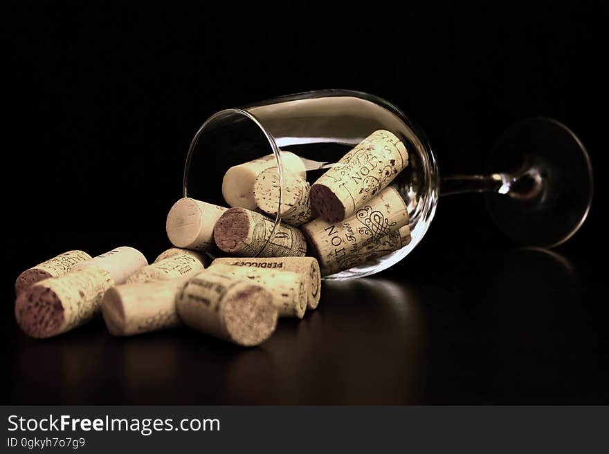 Brown Corks on Clear Wine Glass