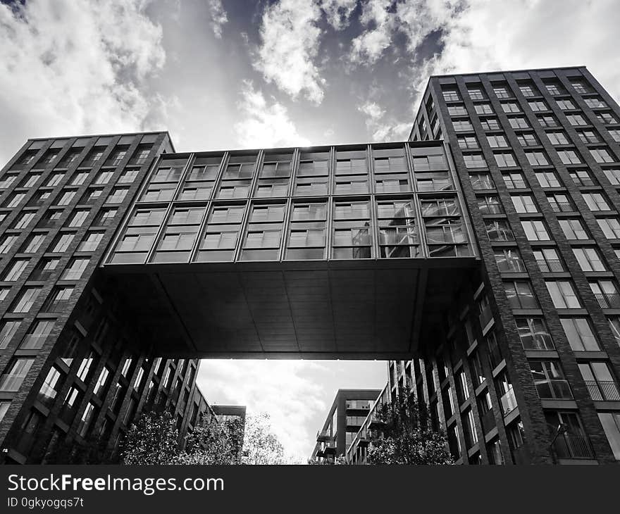 A building with a skyway and an alley passing under it. A building with a skyway and an alley passing under it.