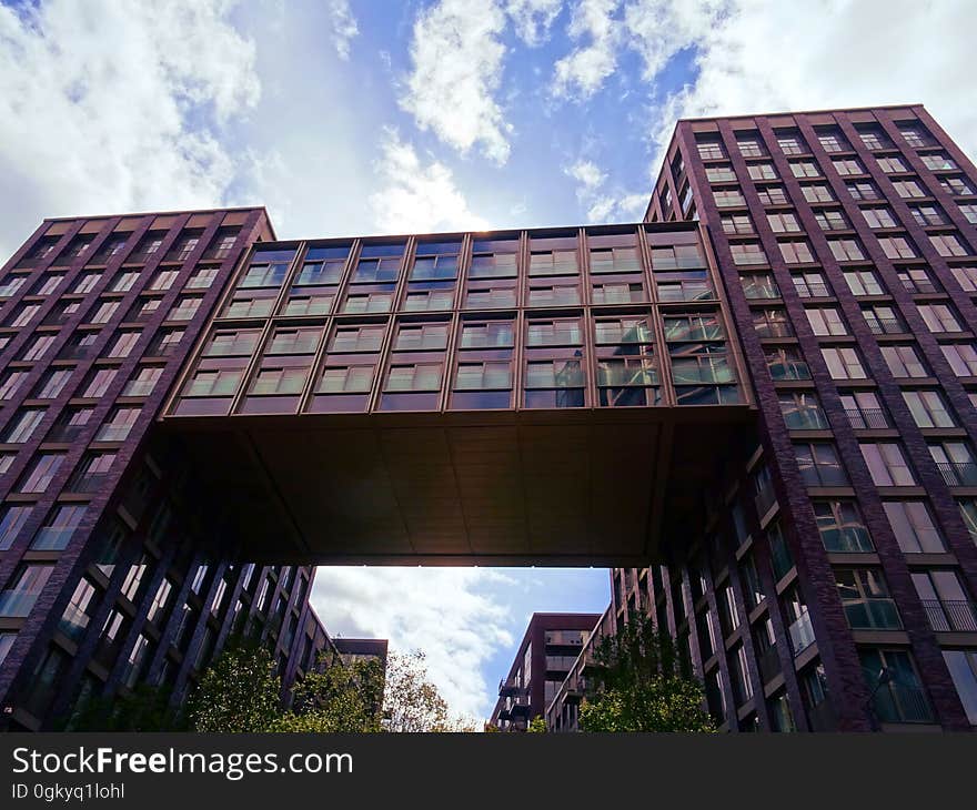 An apartment building or commercial block with a skyway and an alley. An apartment building or commercial block with a skyway and an alley.