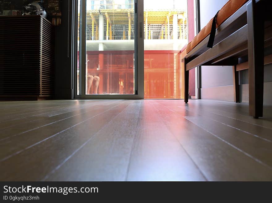 A wooden floor leading to an outside balcony. A wooden floor leading to an outside balcony.