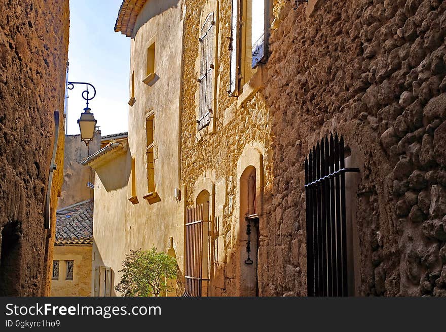 A back alley displaying traditional stone houses.