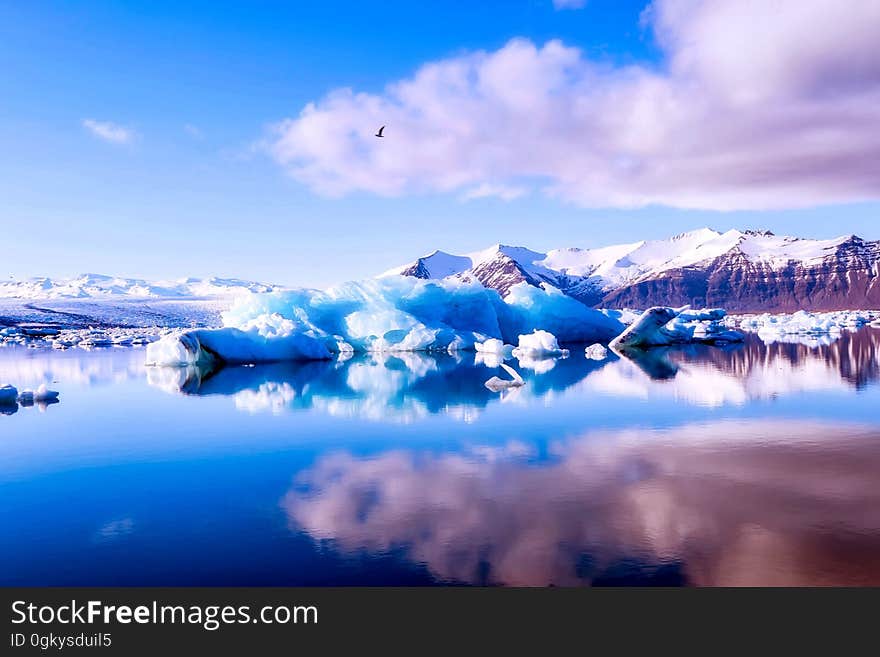 A beautiful lake surrounded by icebergs and mountains. A beautiful lake surrounded by icebergs and mountains.