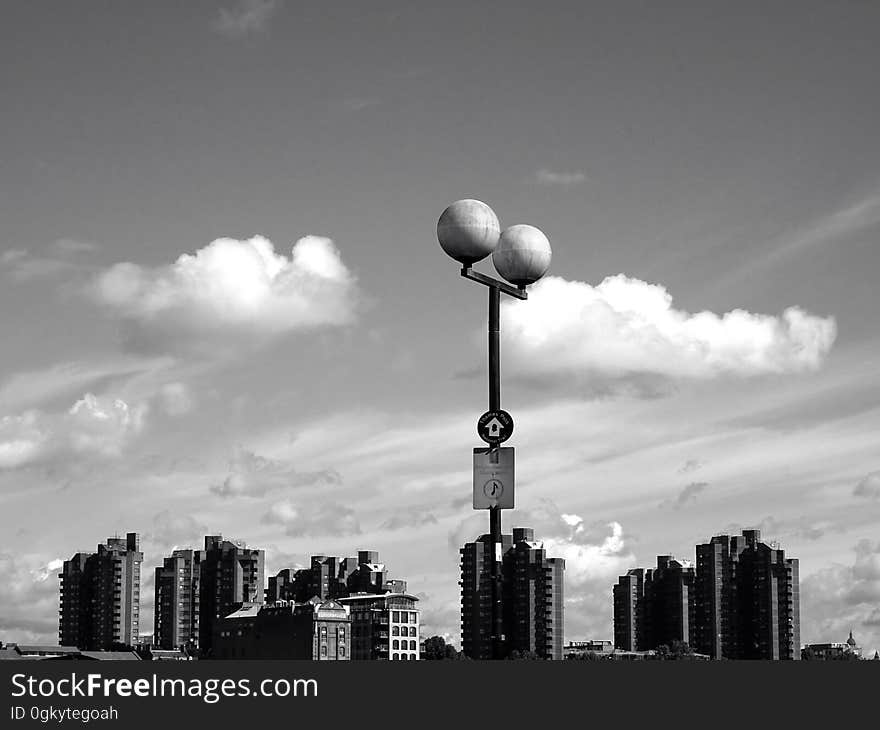 A black and white photograph of city with a street light. A black and white photograph of city with a street light.