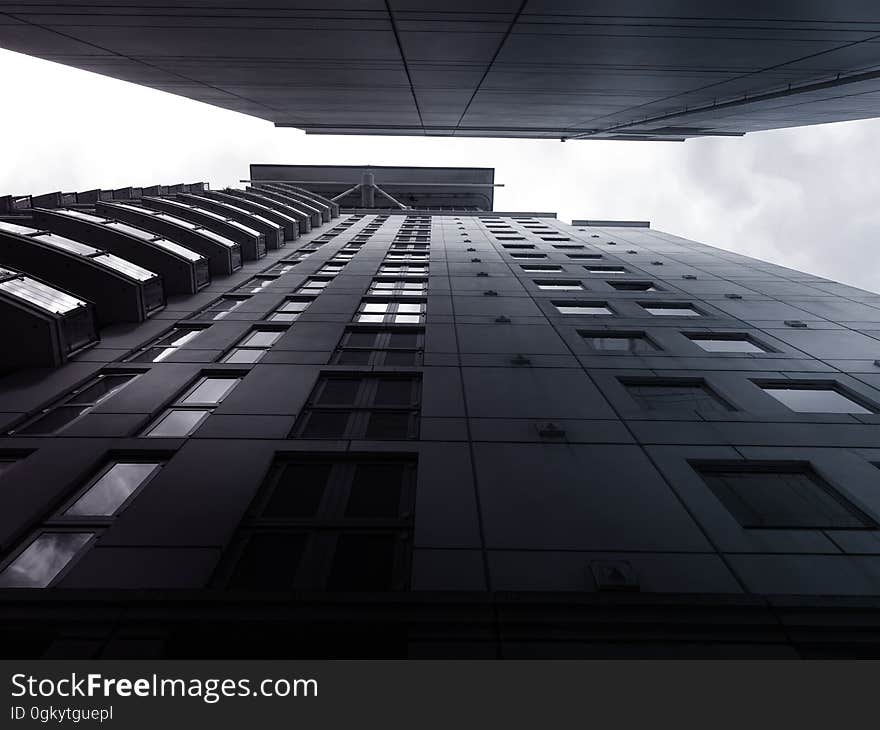 A low angle view of buildings and the sky between them. A low angle view of buildings and the sky between them.