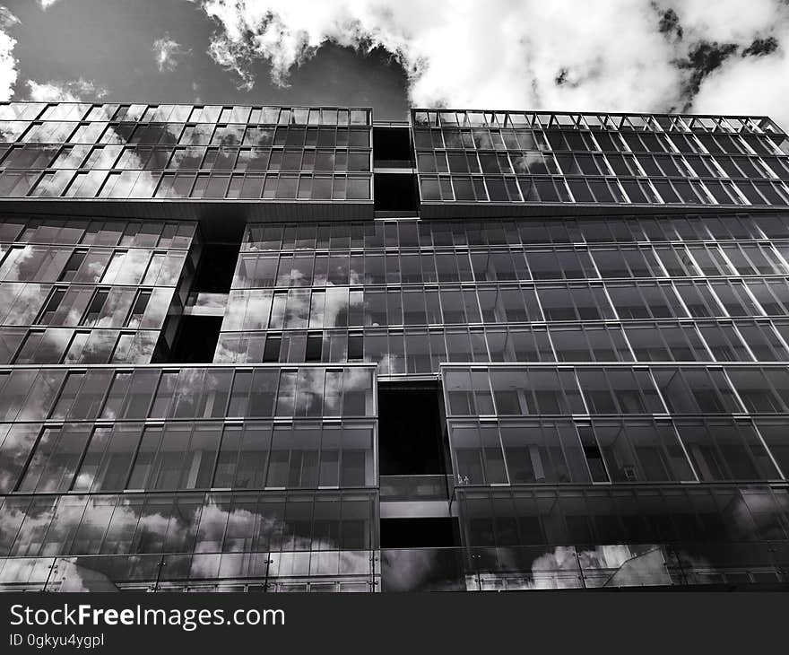 The exterior of a modern, glass building. The exterior of a modern, glass building.