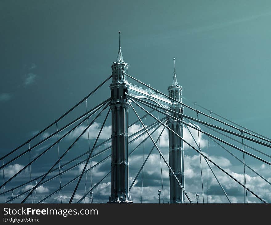 Bridge cables and towers on a sunny day.