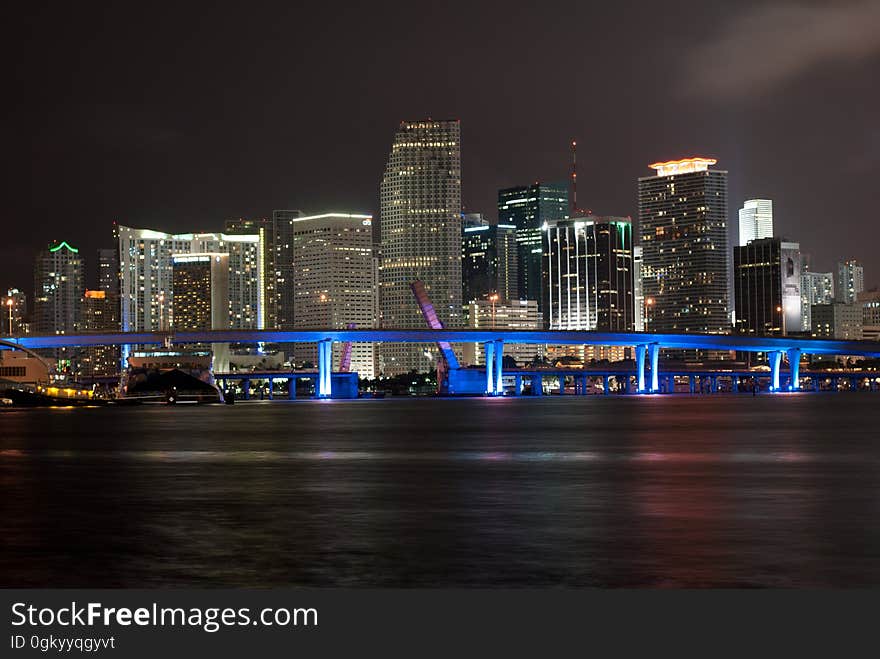 Lights of city skyline illuminated at night in Miami, Florida. Lights of city skyline illuminated at night in Miami, Florida.