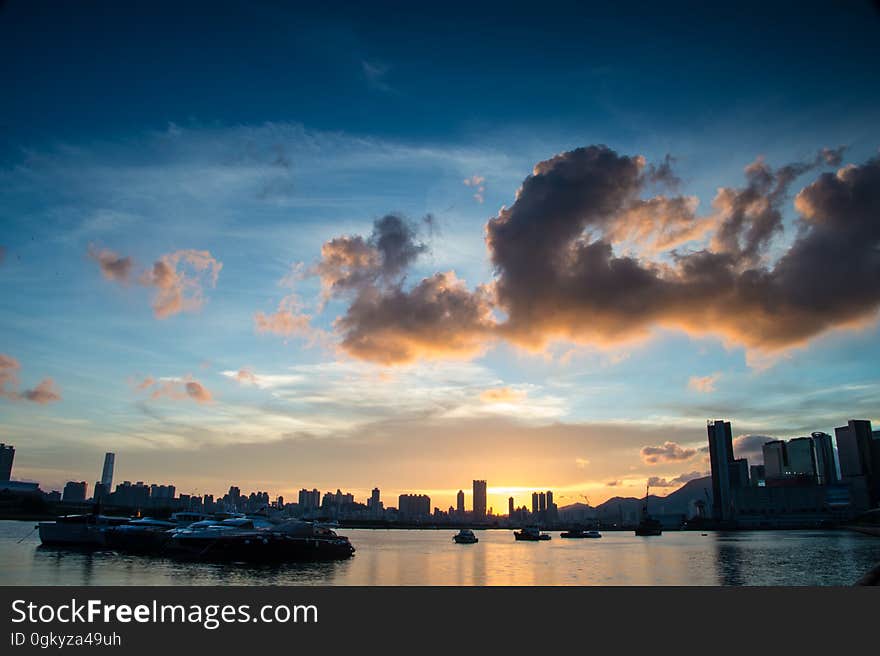 A sunset on the horizon with the city skyline on front. A sunset on the horizon with the city skyline on front.