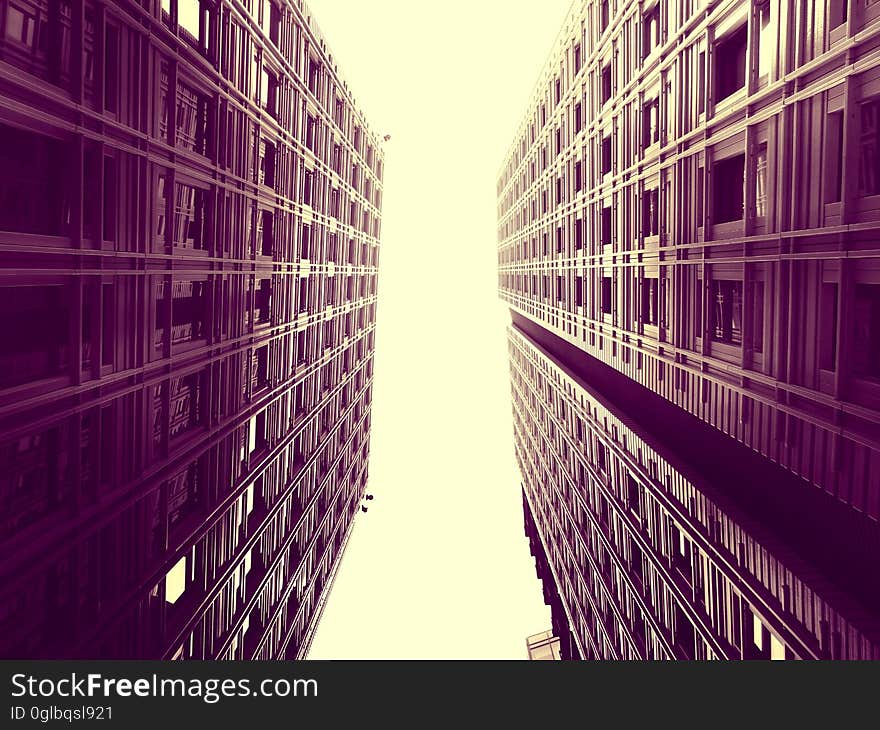 High rise modern buildings against sunny skies in sepia. High rise modern buildings against sunny skies in sepia.