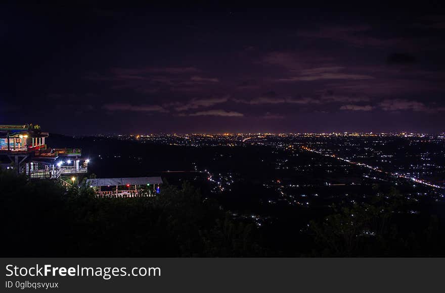 Aerial view of lights from city illuminated at night. Aerial view of lights from city illuminated at night.