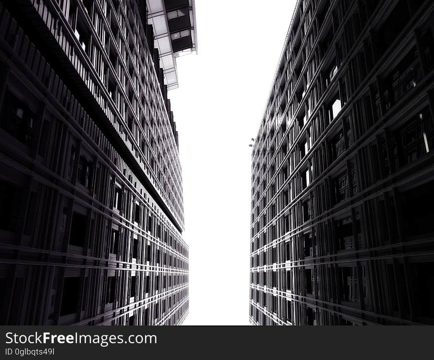 Facade of modern high rise buildings against skies in black and white. Facade of modern high rise buildings against skies in black and white.