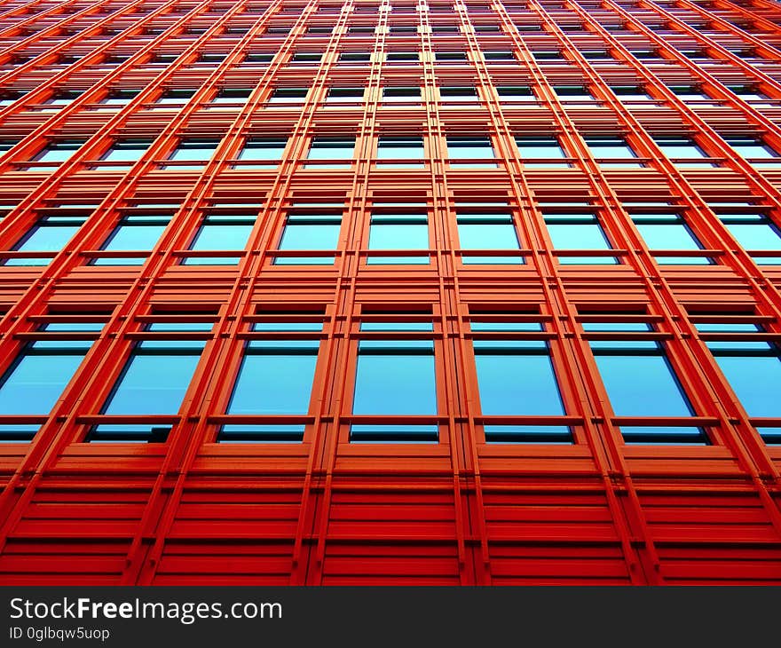 Blue skies reflecting in windows outside modern building. Blue skies reflecting in windows outside modern building.