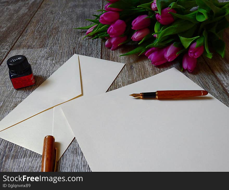 A fresh sheet of stationery with a fountain pen and ink. A fresh sheet of stationery with a fountain pen and ink.