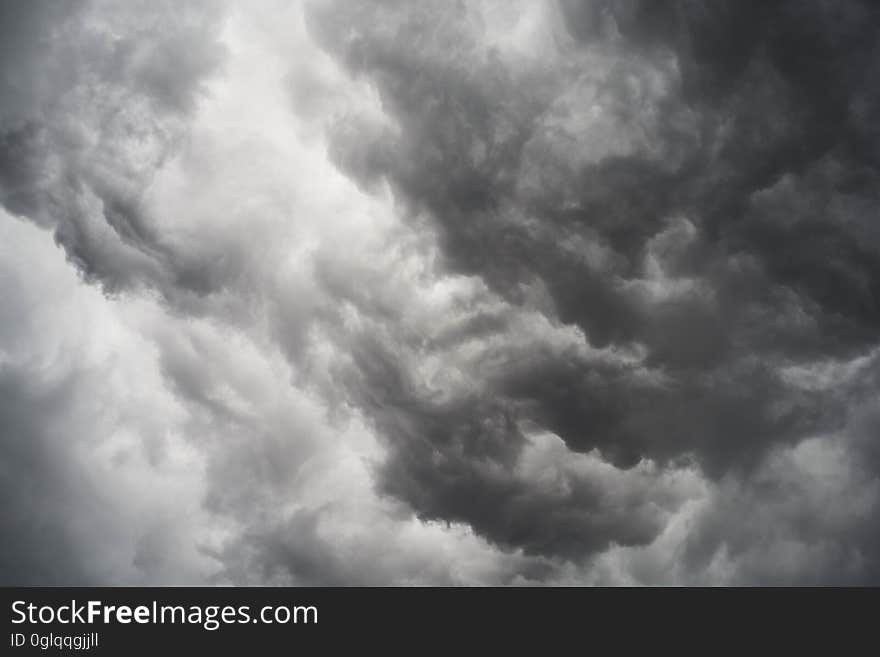 A black and white photo of storm clouds on the sky.