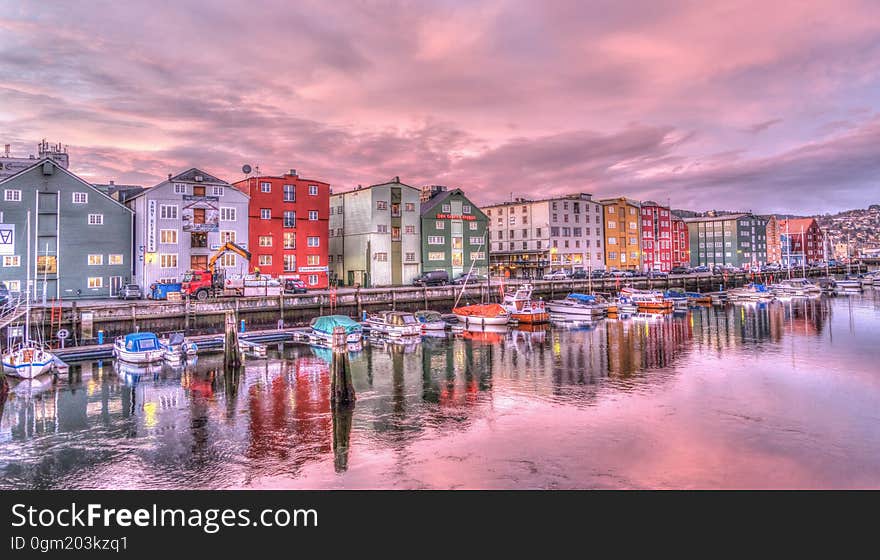 Reflection of Buildings in Water at Sunset