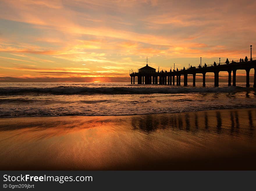 Brown Wooden High Rise Dock Near the Ocean