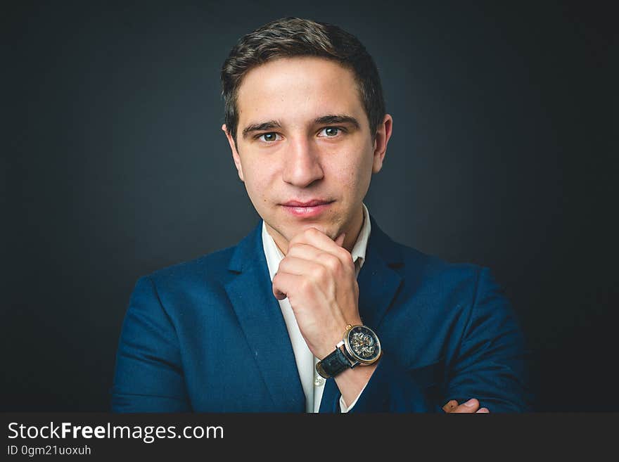 A portrait of a businessman with an elegant wrist watch. A portrait of a businessman with an elegant wrist watch.