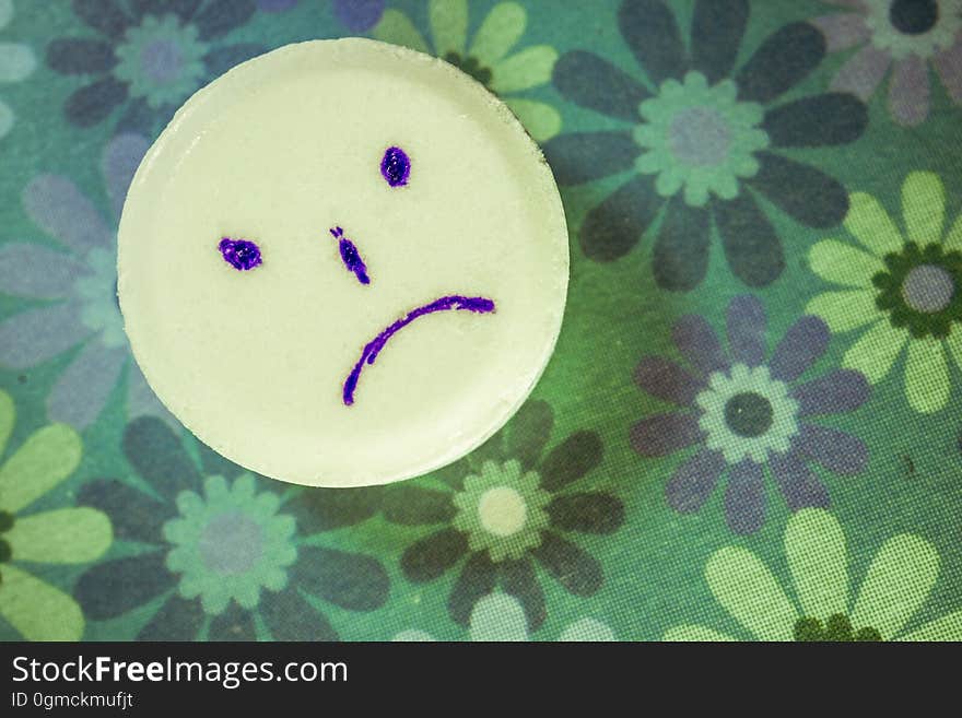 Sad tablet on a floral background