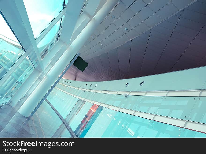 A close up of a modern building with curved glass wall.