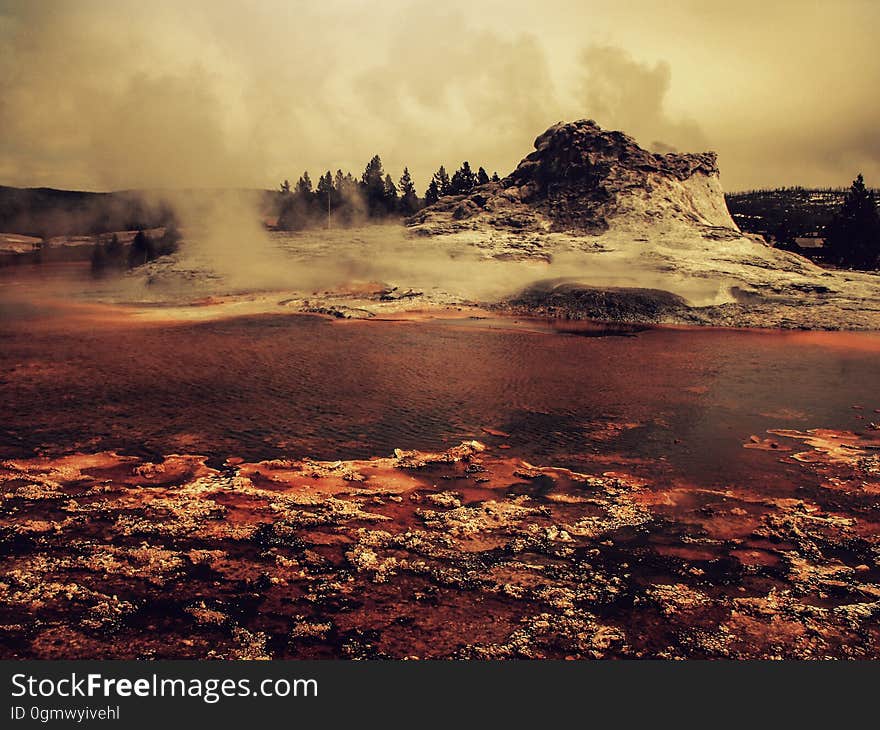 A volcano erupting in the background.