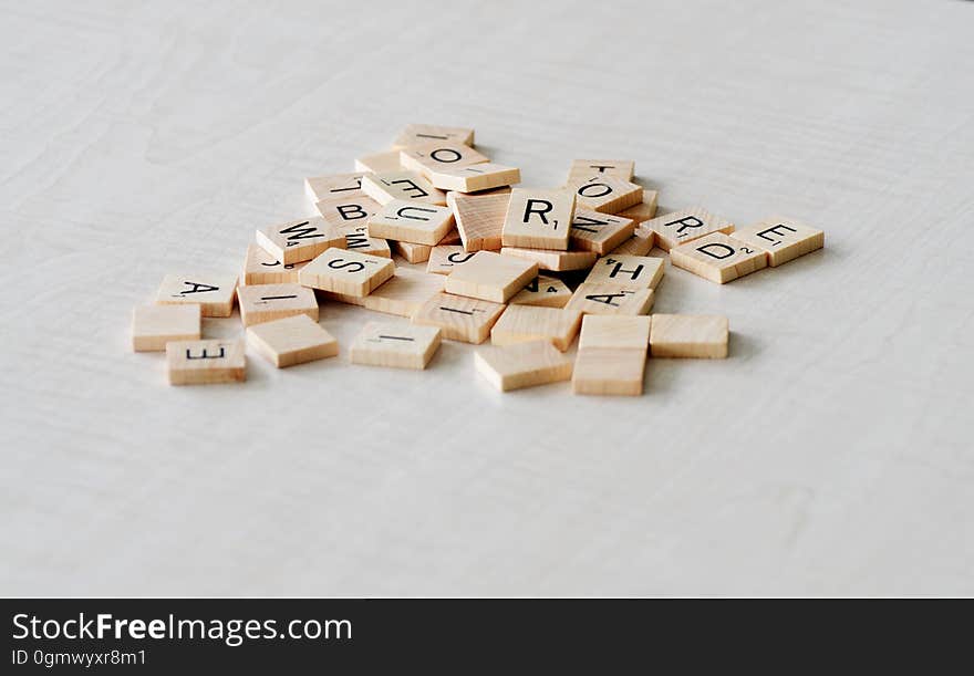 A pile of Scrabble letters.