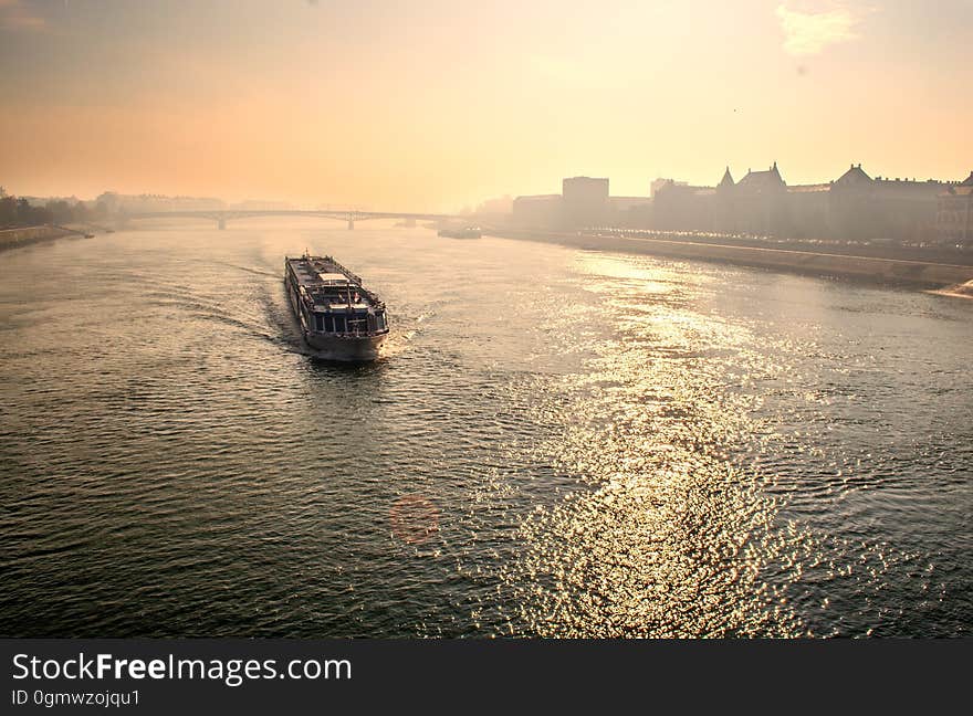 Boat in Sea Against Sky during Sunset