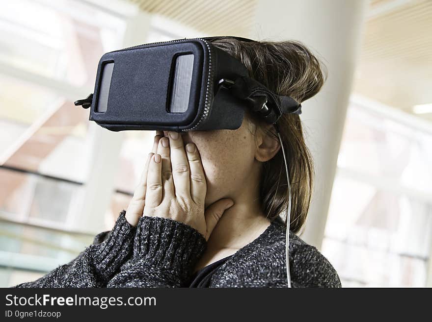 Woman with virtual reality glasses playing, technology and entertainment. Woman with virtual reality glasses playing, technology and entertainment