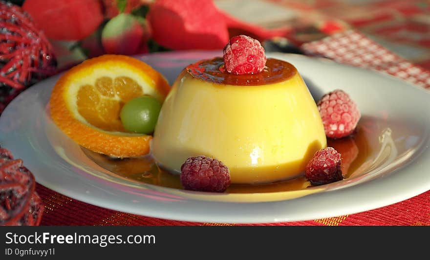 Closeup of raspberry and citrus panna cotta.