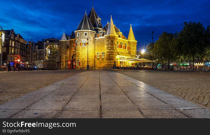 The Nieuwmarkt and the Waag building in Amsterdam in the night. The Nieuwmarkt and the Waag building in Amsterdam in the night.