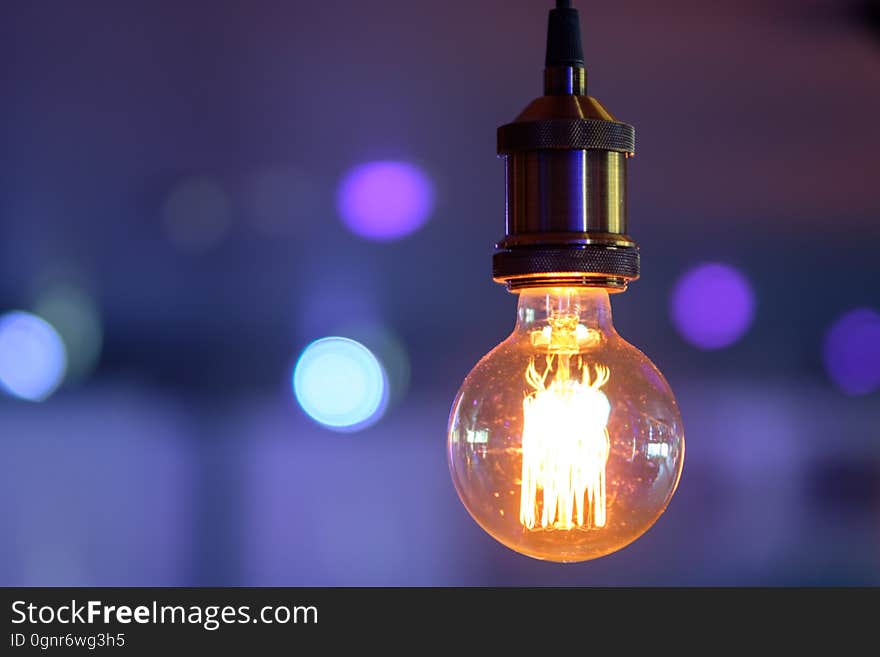 Incandescent lamp on colorful background