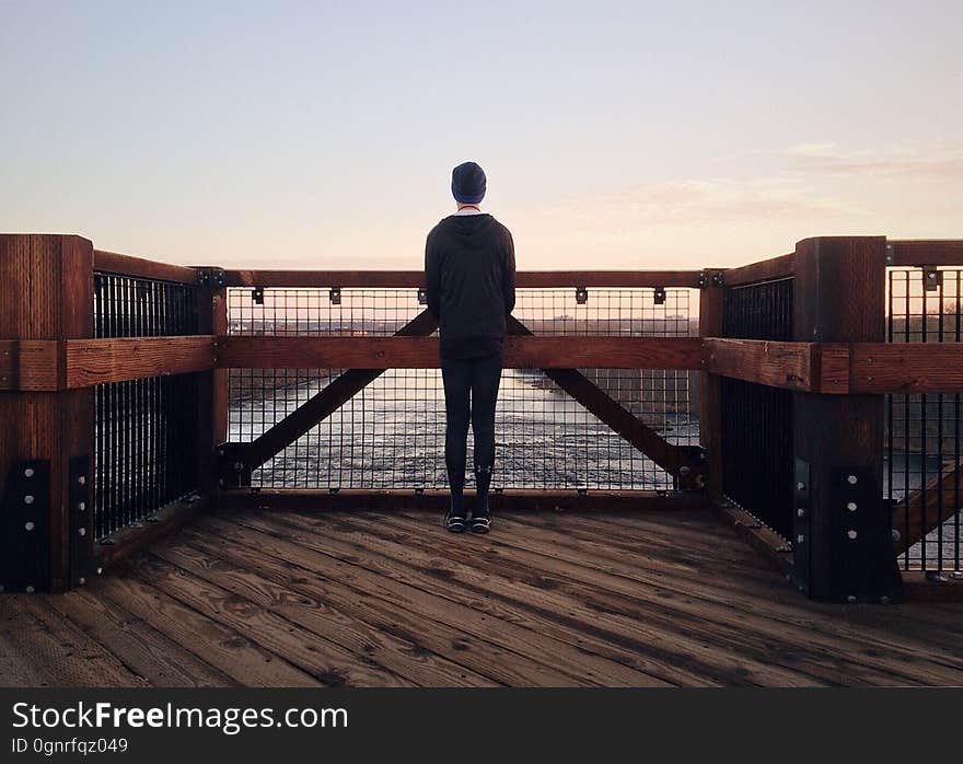 Rear View of a Man Walking on Beach