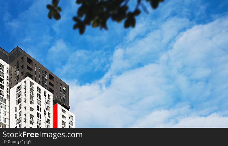 Tall modern buildings with the sky in the background.