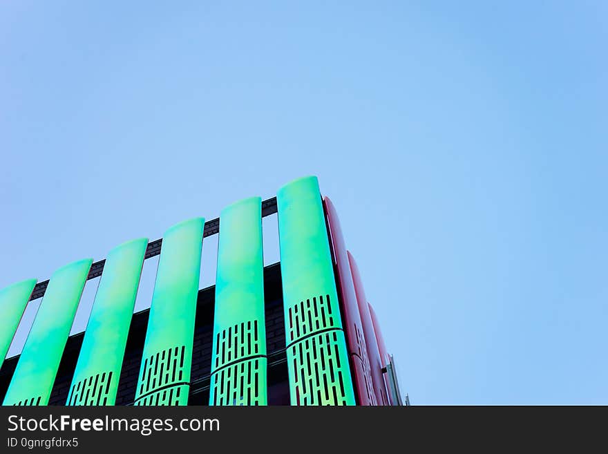 Exterior of modern high rise building against blue skies on sunny day. Exterior of modern high rise building against blue skies on sunny day.