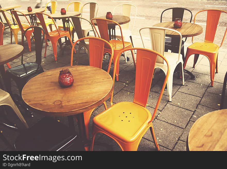 Empty table and chairs in outdoor cafe on sunny day. Empty table and chairs in outdoor cafe on sunny day.