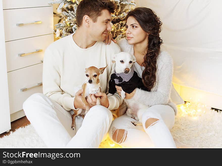 Portrait of Happy Young Woman With Puppy