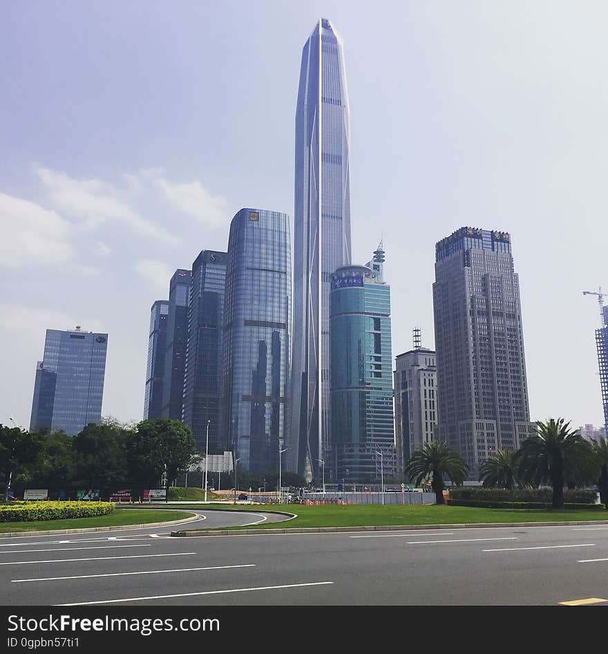 Skyscrapers in city skyline against blue skies in Shenzhen, China. Skyscrapers in city skyline against blue skies in Shenzhen, China.