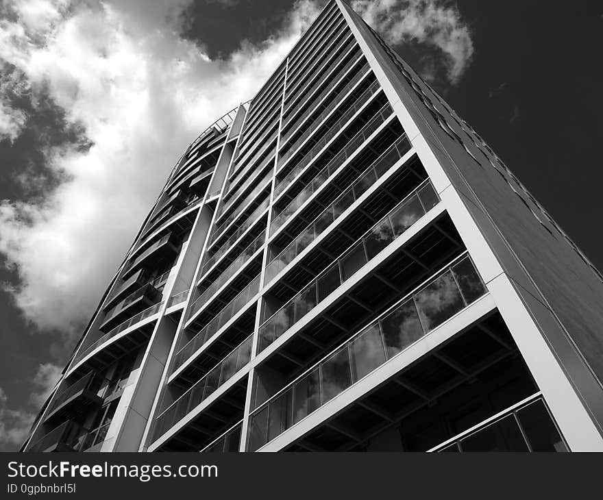 Almost abstract background of architectural design of high rise apartment block with both straight and curved balconies. Almost abstract background of architectural design of high rise apartment block with both straight and curved balconies.